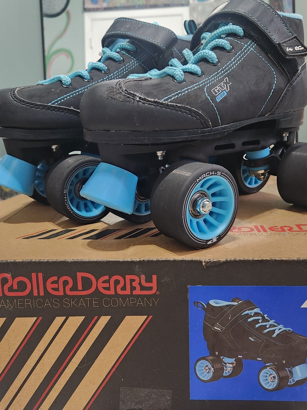 Roller Derby Women's Black and Blue Quad Roller Skates